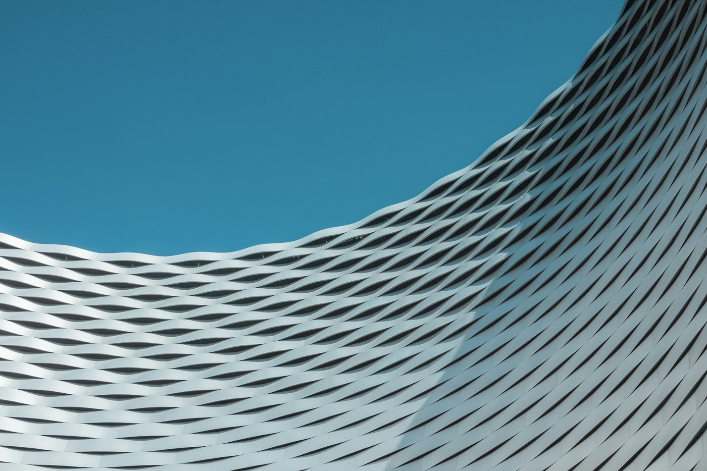 A modern building with geometric structure, evoking a modular, coordinated architecture (illustrative image)